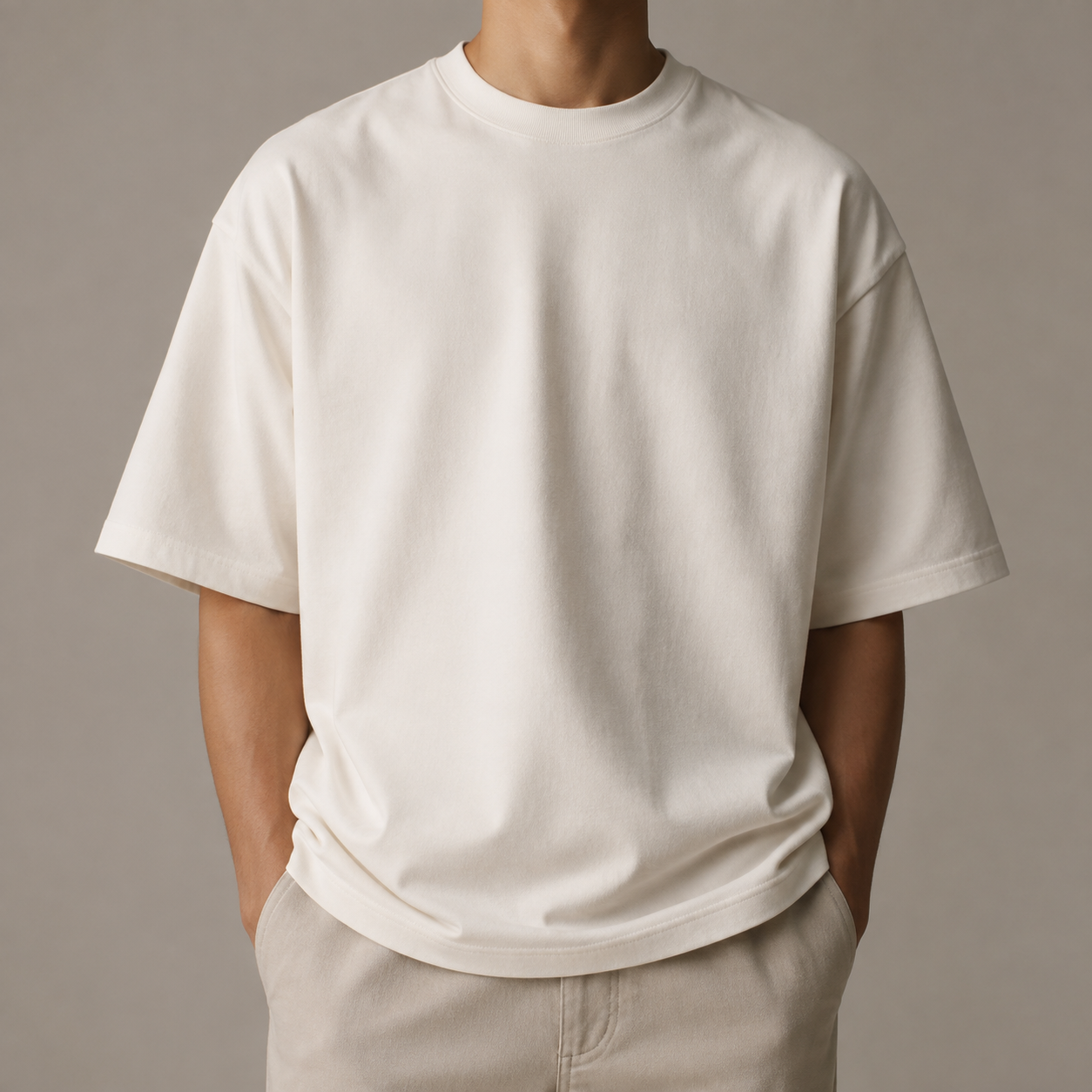 Bone-white heavyweight oversized T-shirt worn in studio